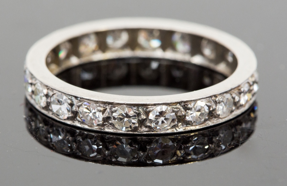 A platinum and diamond eternity ring, set with twenty round brilliant cut diamonds, each approx 0.