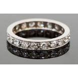 A platinum and diamond eternity ring, set with twenty round brilliant cut diamonds, each approx 0.