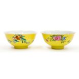 A matched pair of yellow ground bowls, marks od Quianlong, each with an incised vermiculated