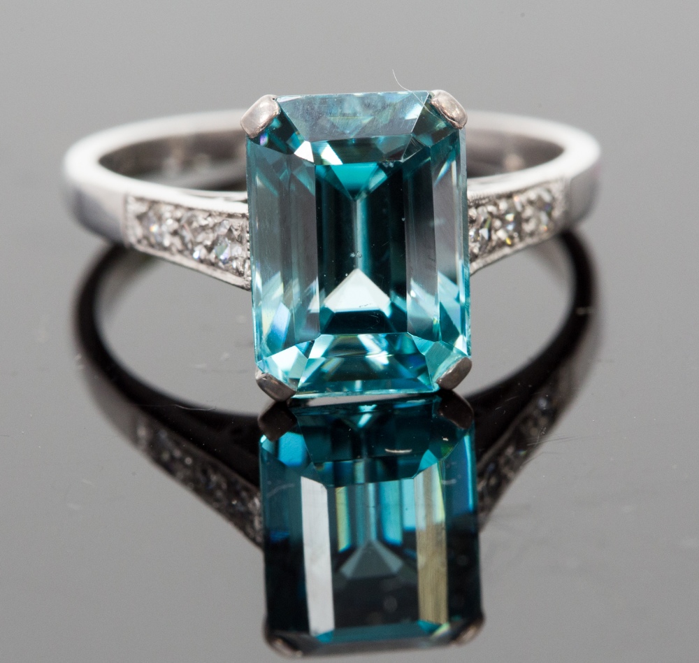 An 18ct white gold, zircon and diamond ring, set with a step-cut blue zircon approx 5.24cts,