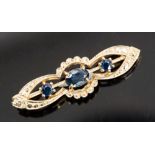 A 9ct gold and and sapphire brooch, set