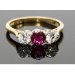 An 18ct gold, ruby and diamond three-sto