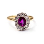 A ruby and diamond cluster ring, set wit