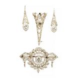 A Belle Epoque platinum and diamond brooch, of leaf and geometric form, the central stone approx