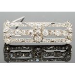 An Art Deco diamond brooch, of rectangular openwork design, millegrain set with old and rose-cut