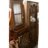 A collection of dark wood old charm style furniture, including corner cupboard, hanging cupboard,