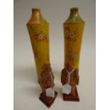 A pair of early 20th Century Japanese Satsuma pottery cylindrical bottle vases, yellow ground