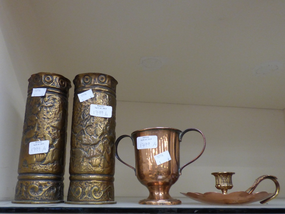 A pair of Trench Art shell vases, with repousse floral decoration,