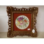 A Minton circular painted wall plaque with flowers
