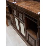 A veneered bur-walnut sideboard. beveled mirrors to central doors, mirrored shelves. Keys