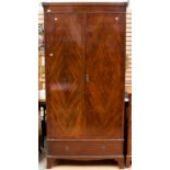 A late Victorian walnut double wardrobe, fitted with two doors opening to reveal drawers and