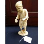 A Japanese carved ivory okimono of a man with a wooden leg, 15cm high