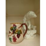 A large ceramic Polar Bear (af) fourteen inches tall approx with a large floral jug
