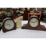 A modern carriage clock and two mantel clock