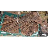 A collection of Blacksmith's tools, probably dating to the early 20th century, horse shoes,