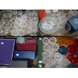 A large collection of cut glass including boxes of Bohemian crystal decanter and tumbler set,