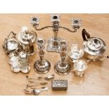 A four piece Viners (Sheffield) tea service, a three prong candelabra and a pair of candlesticks,