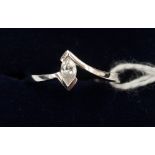 A 9ct white gold single stone diamond ring, the diamond weighing 0.15ct, complete with box