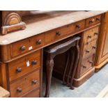 A mid Victorian mahogany pedestal desk, the upper section fitted with a later pitch pine top,