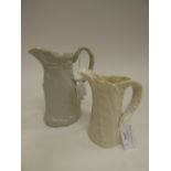 A Victorian moulded stoneware jug and a Worcester leaf jug -  (2)