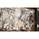 A large collection of assorted silver plated flatware, comprising teaspoons, dinner knives and