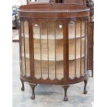 A mahogany bow fronted display cabinet