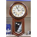 A large wall hanging clock by Ansonia Clock Co, New York, in walnut veneer case, 13 inch enamelled