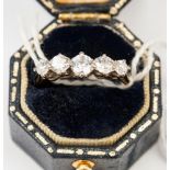 **RE-OFFER MAY 200/250**An 18ct gold ring of five diamonds, approx 0.