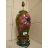 A Moorcroft lamp base, green ground, with Hibiscus pattern,