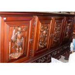 A Romanesque style modern four door and four drawer sideboard,