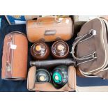 Three pairs of bowling green balls, in original carrying cases, the balls in lignum vitie all