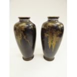 A pair of late 19th century Japanese vases, of tapering form, each decorated with gilt foliage on a