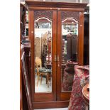 A late Victorian mahogany triple wardrobe,