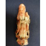 A Chinese hard stone carved OBI wise man