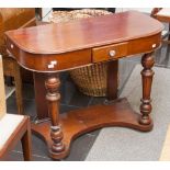 An early Victorian mahogany side table, fitted with a later drawer, raised on turned columns and