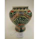 An oriental baluster vase, green/iron red/yellow decoration