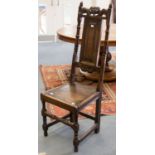 A Carolean style back stool, with a crown carved chest table, pummeled back and a paralleled seat