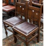 A set of four George V Jacobean style oak dining chairs, with drop in seats,