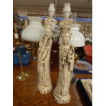 A pair of Chinese figural table lamps, in ivory effect, eac in the form of a Chinese lady and