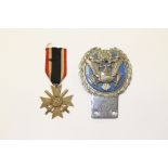 A German Third Reich War merit cross, 2nd class and a car badge USA National Insignia by J.R.