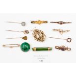 Four gold stick pins, five Victorian/Edwardian brooches, a malachite brooch, jadeite brooch, etc