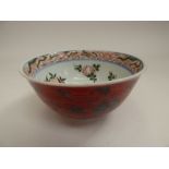 An oriental porcelain bowl (small) red/silver exterior, interior painted with fruit
