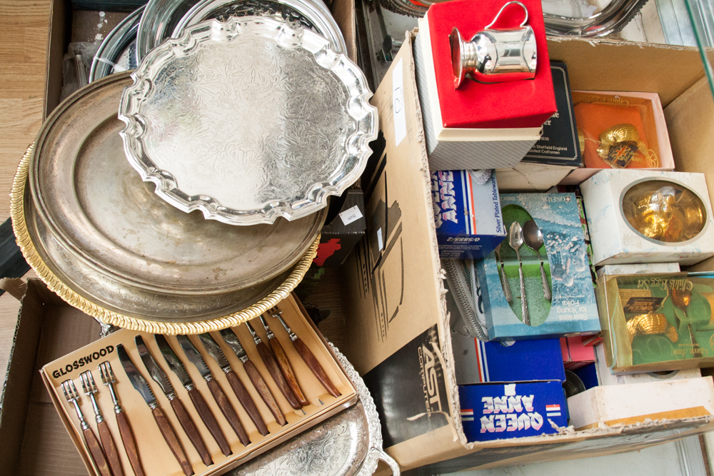 A box of Queen Anne silver plate, etc, mostly boxed to include toast rack, trays, cups, butter