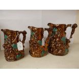 Three moulded copper lustre jugs