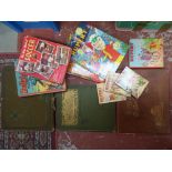 A collection of assorted books including Rupert Books, six boxes of yearly annuals,