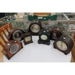 Seven clocks to include black slate and wood bracket clock, and five mantle clocks (7)