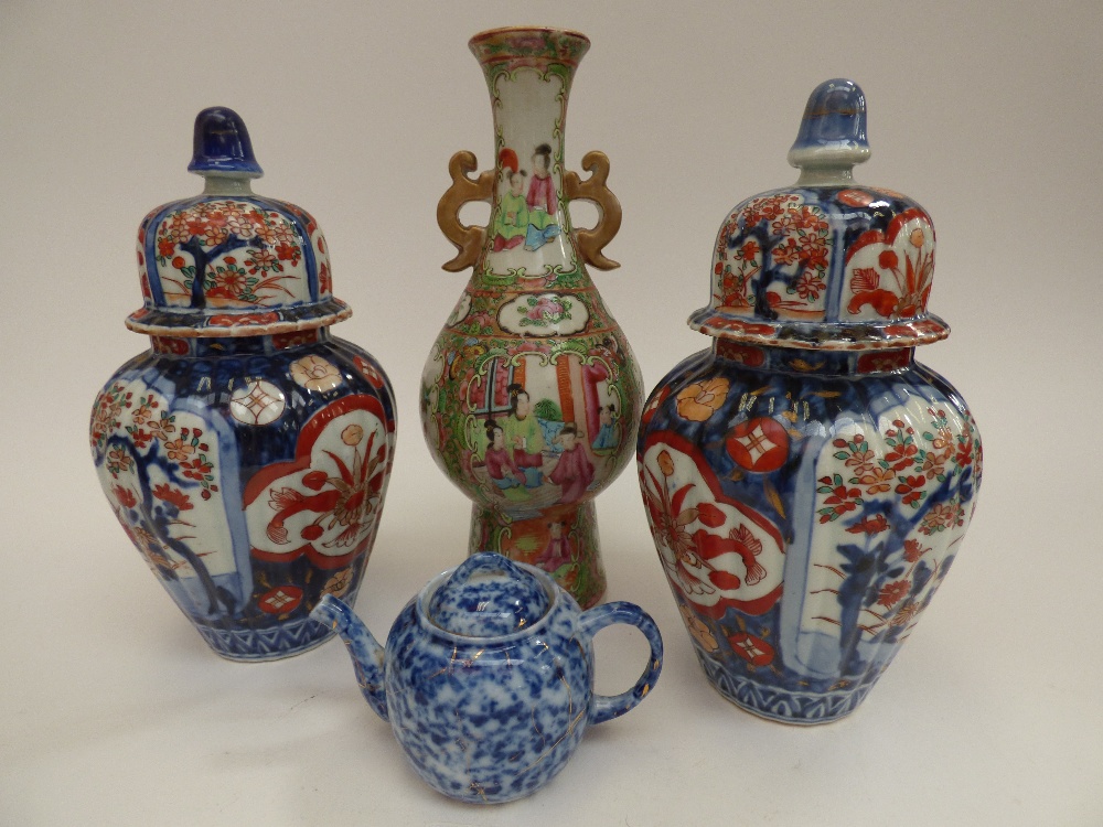 A pair of Imari pallet Ginger jars and covers,