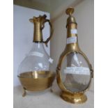 **REOFFER IN MAY £20 - £30** A glass/brass wine decanter and companion claret jug,