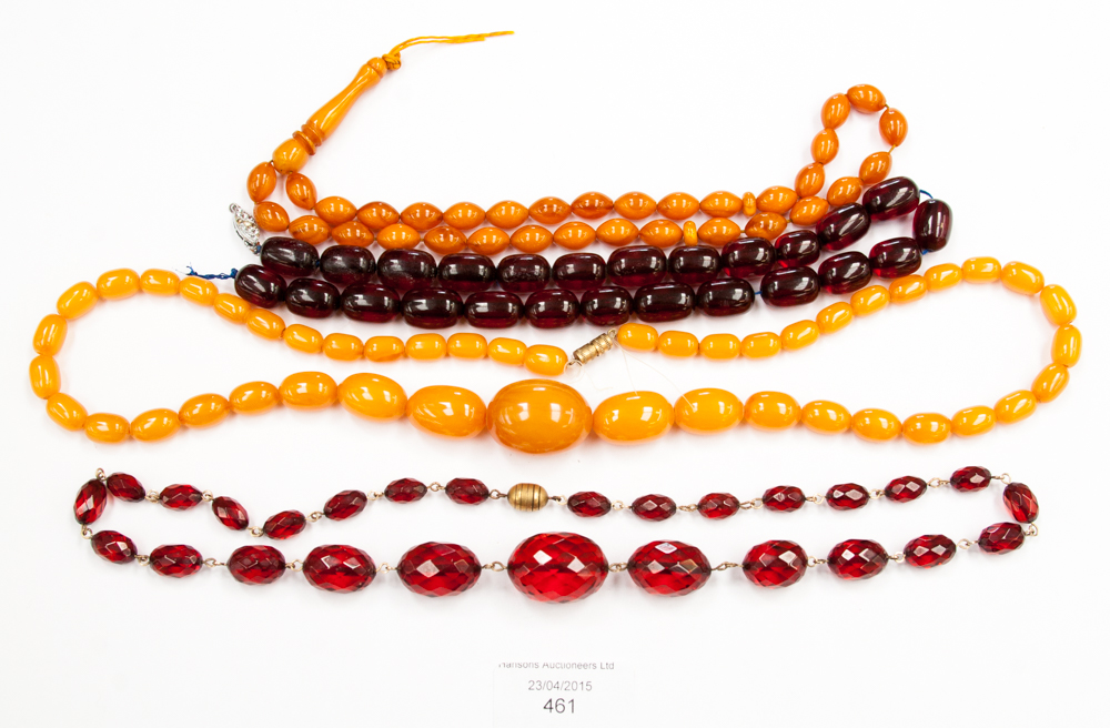Three amber style necklaces and another (4)