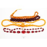 Three amber style necklaces and another (4)